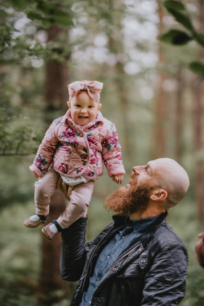 father holding daughter