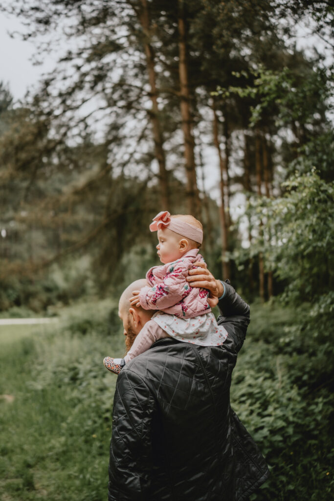 dad carrying daughter