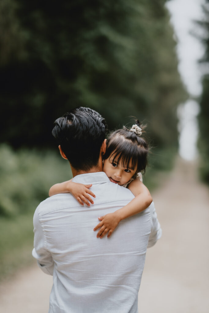 daughter embracing father