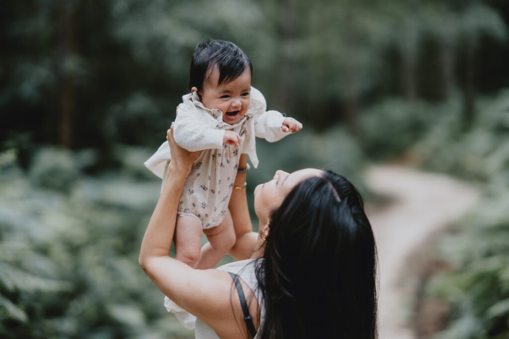 mum holding baby in the air