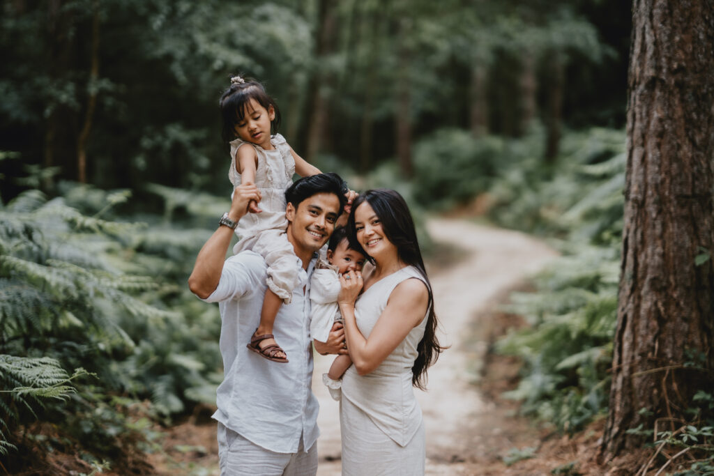 family portrait in lush woods