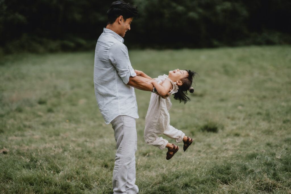 dad swinging girl around