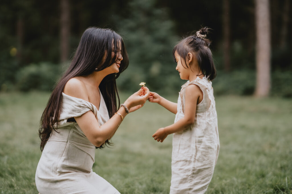 girls and mum playing at family photoshoot