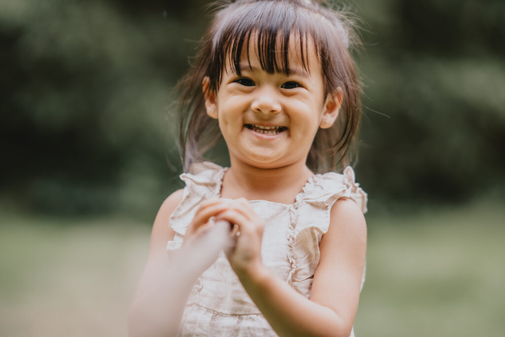 girl playing with a stick