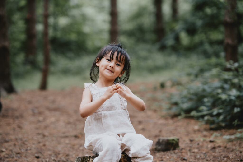 girl making heart shape