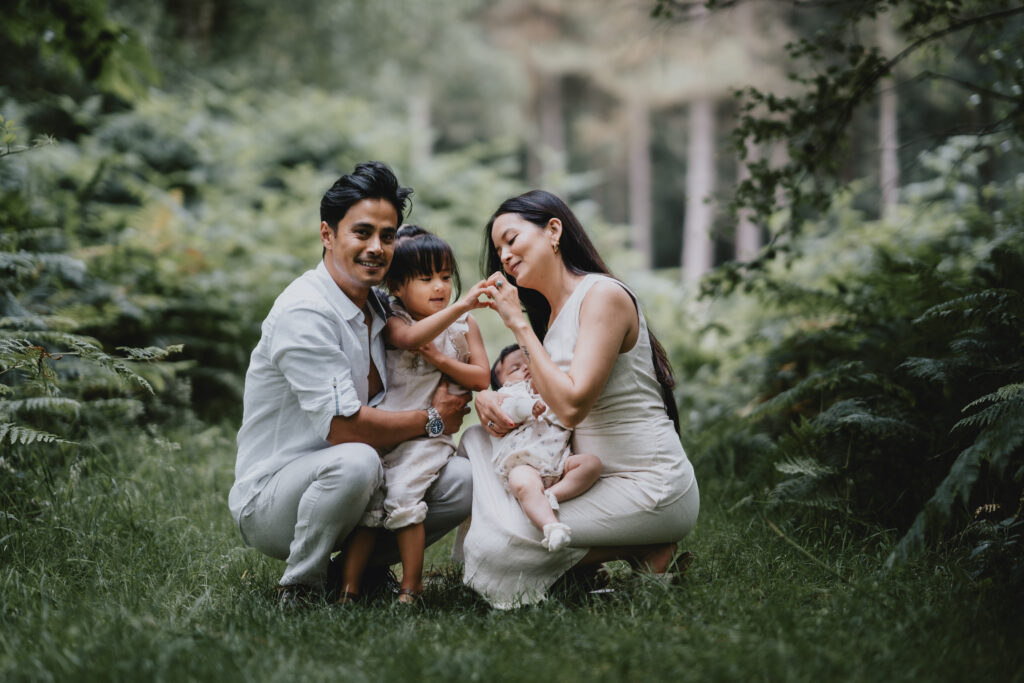 family portrait in wooded area